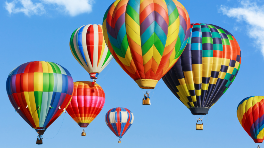 Colorful hot air balloons in a blue sky