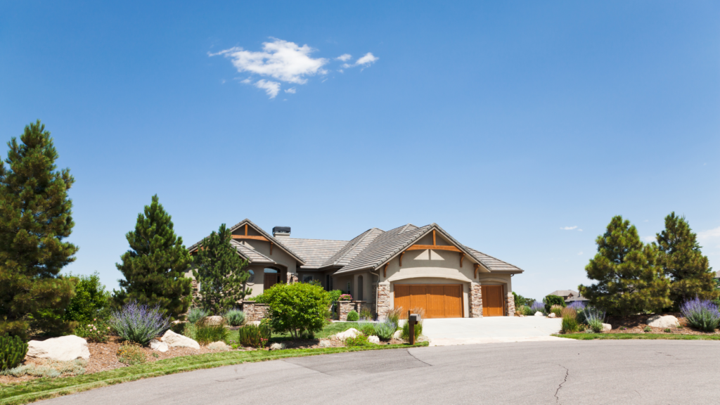 Beautiful Colorado ranch home with wood trim and garage doors